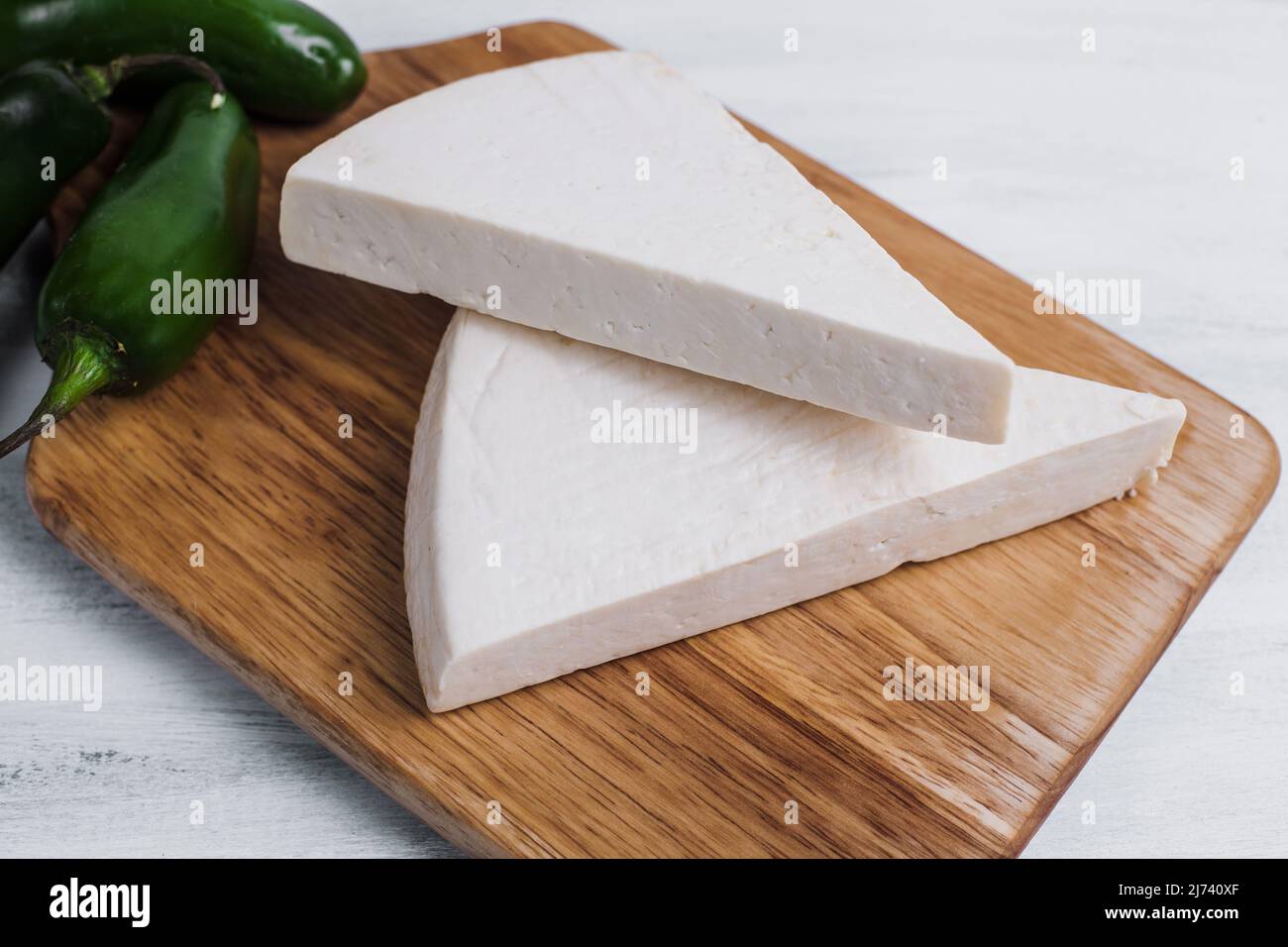 Mexican white Cotija cheese with fresh ingredients in Mexico Latin