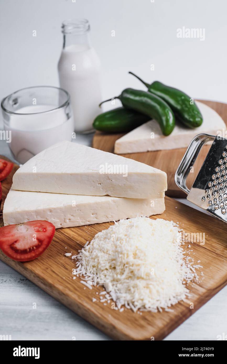 Mexican white Cotija cheese with fresh ingredients in Mexico Latin