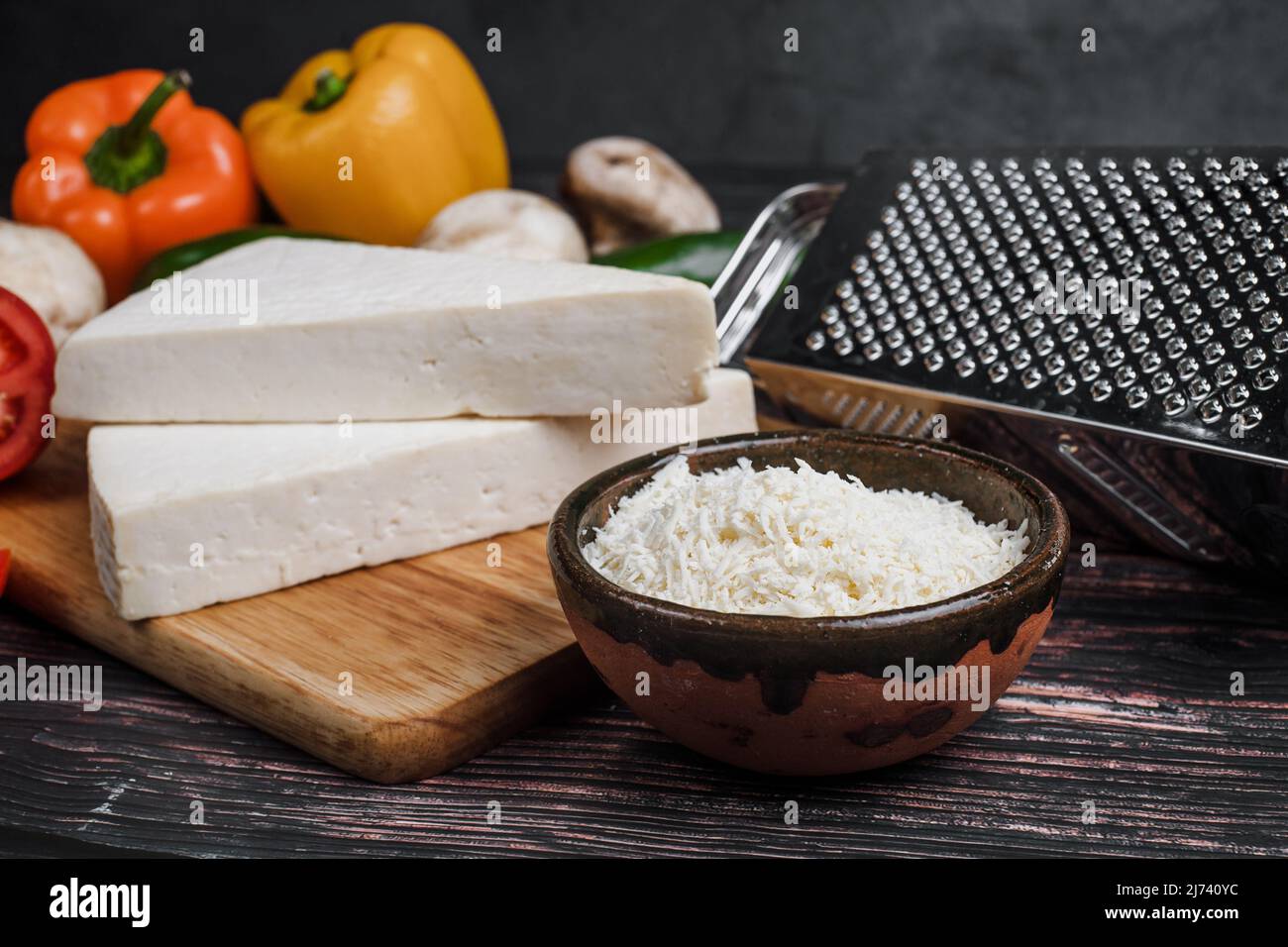 Mexican white Cotija cheese with fresh ingredients in Mexico Latin