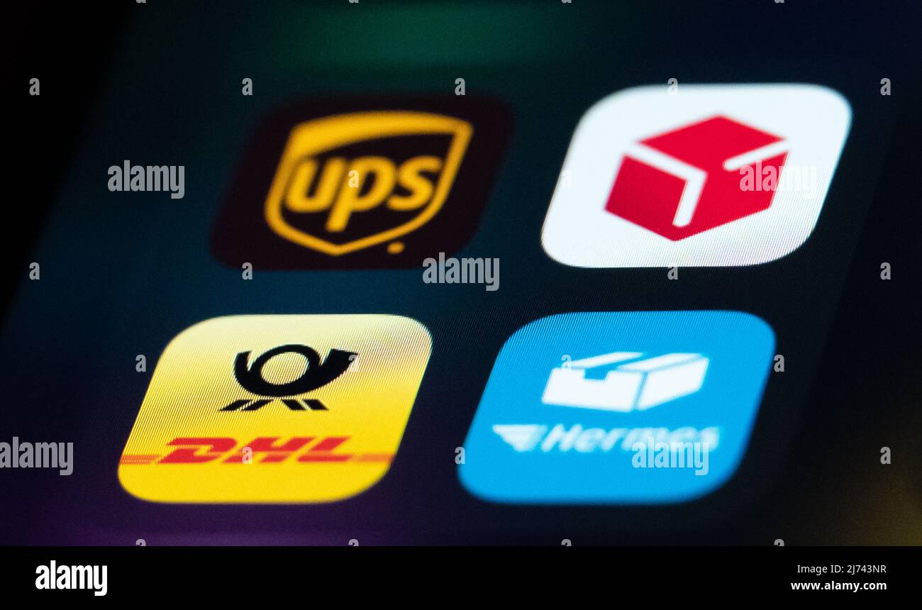 05 May 2022, Baden-Wuerttemberg, Rottweil: The application apps from United  Parcel Service (top left, UPS) DPD (top right), Deutsche Post DHL (bottom  left) and Hermes can be seen on the display of