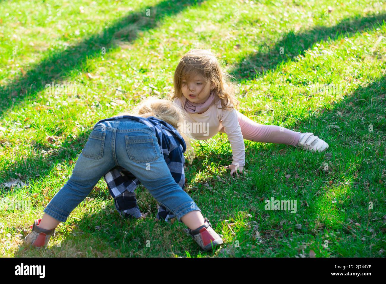 Girl playing playground upside down hi-res stock photography and images ...