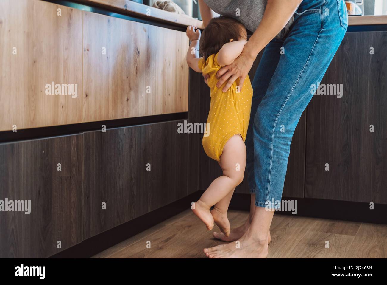 The mother raises the baby, who cries that she wants in the mother's