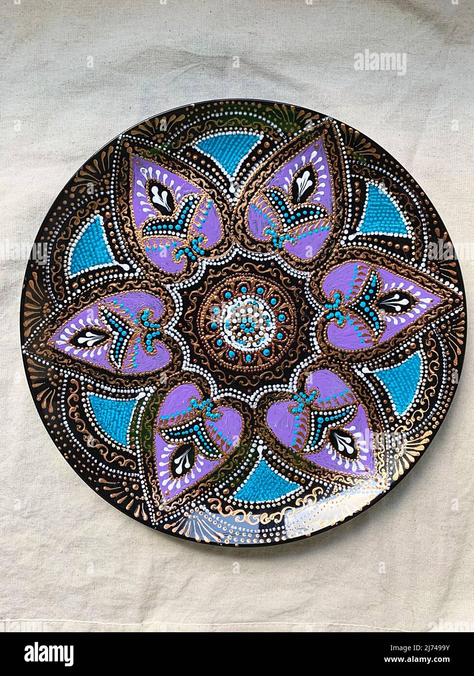 Decorative ceramic plate with different colors. painted plate on white ...