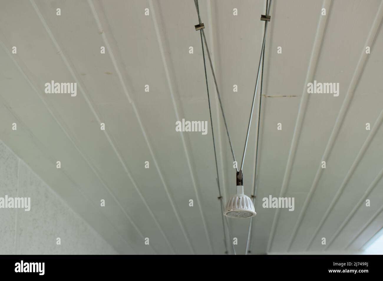 smal lamp on a white ceiling Stock Photo