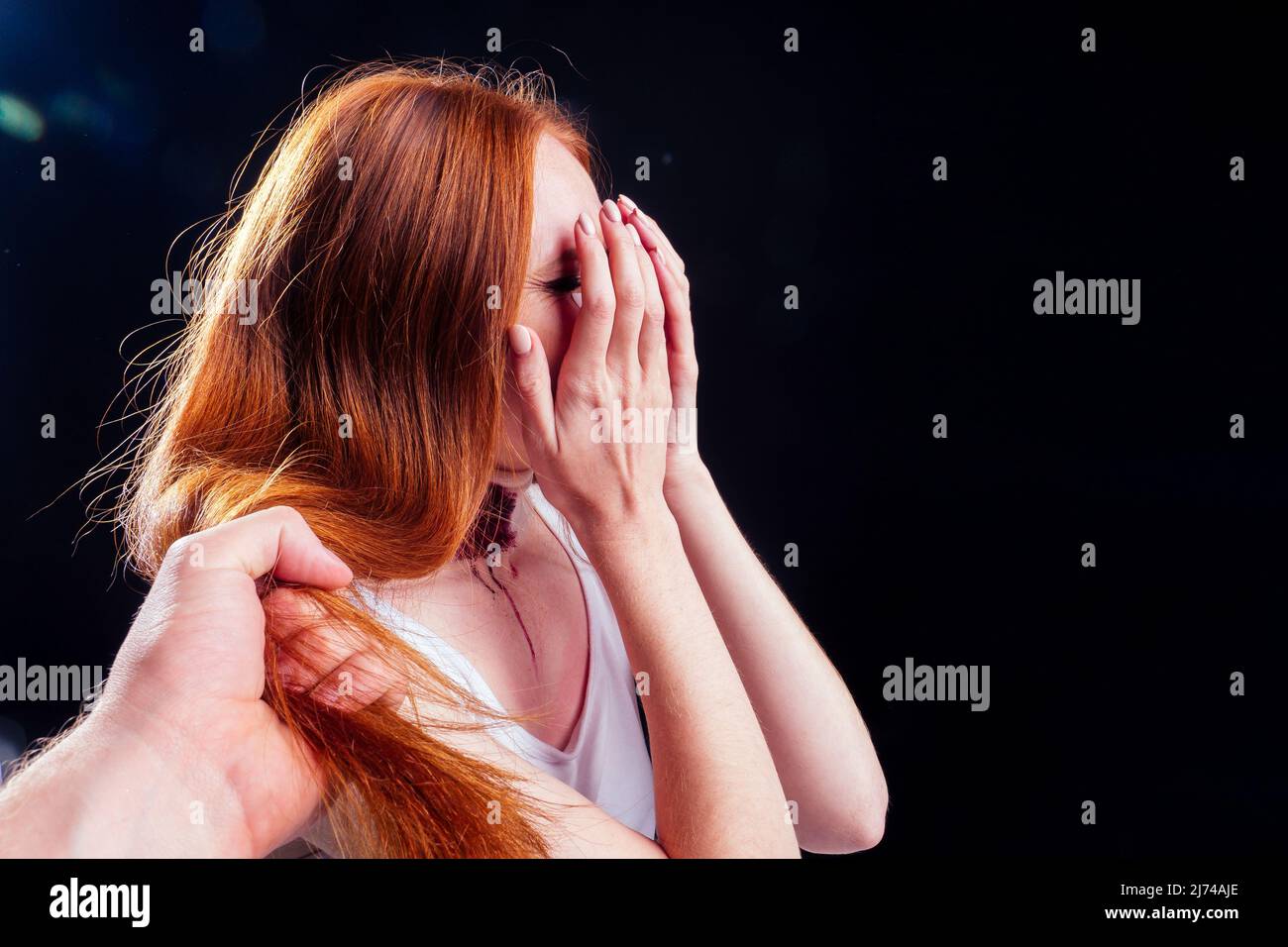 Depressed outsider student crying after intruder attacker rapist Stock Photo