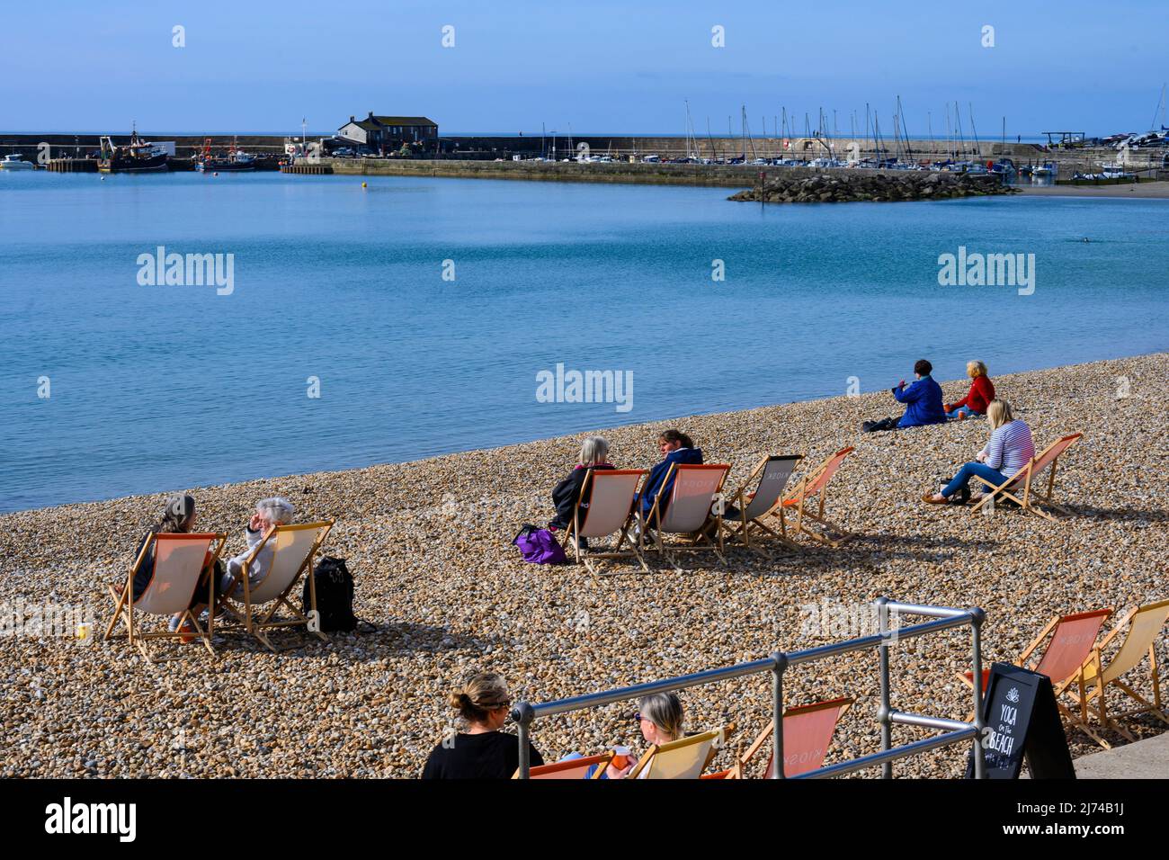 Lyme Regis, Dorset, UK. 6th May 2022. UK Weather: Scorching hot sunshine and clear blue skies at the seaside resort  of Lyme Regis. The sun was already blazing by 9am this morning at the pretty coastal resort. Credit: Celia McMahon/Alamy Live News Stock Photo