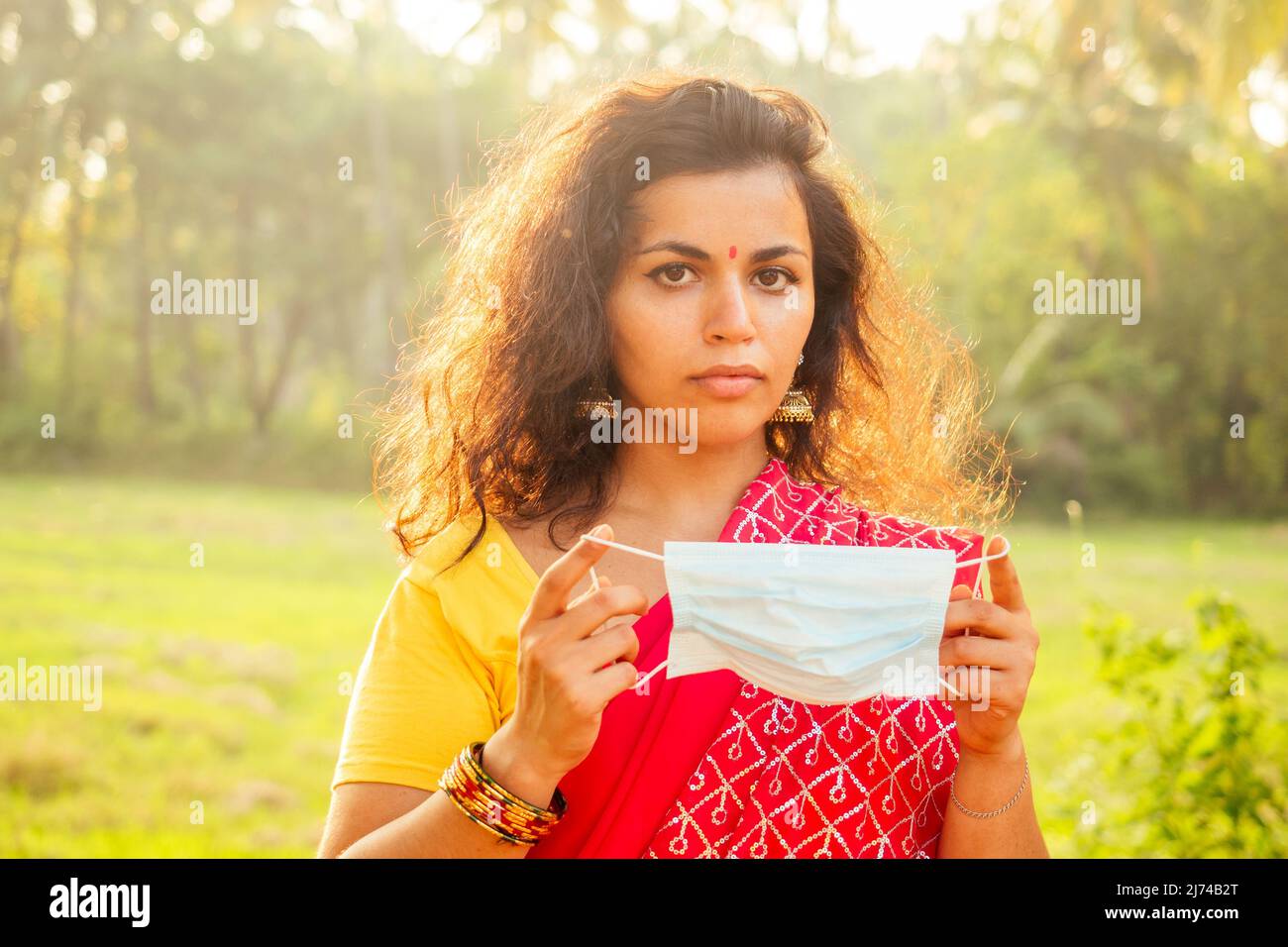 portrait of a young indian woman wearing mask. the concept of tourism