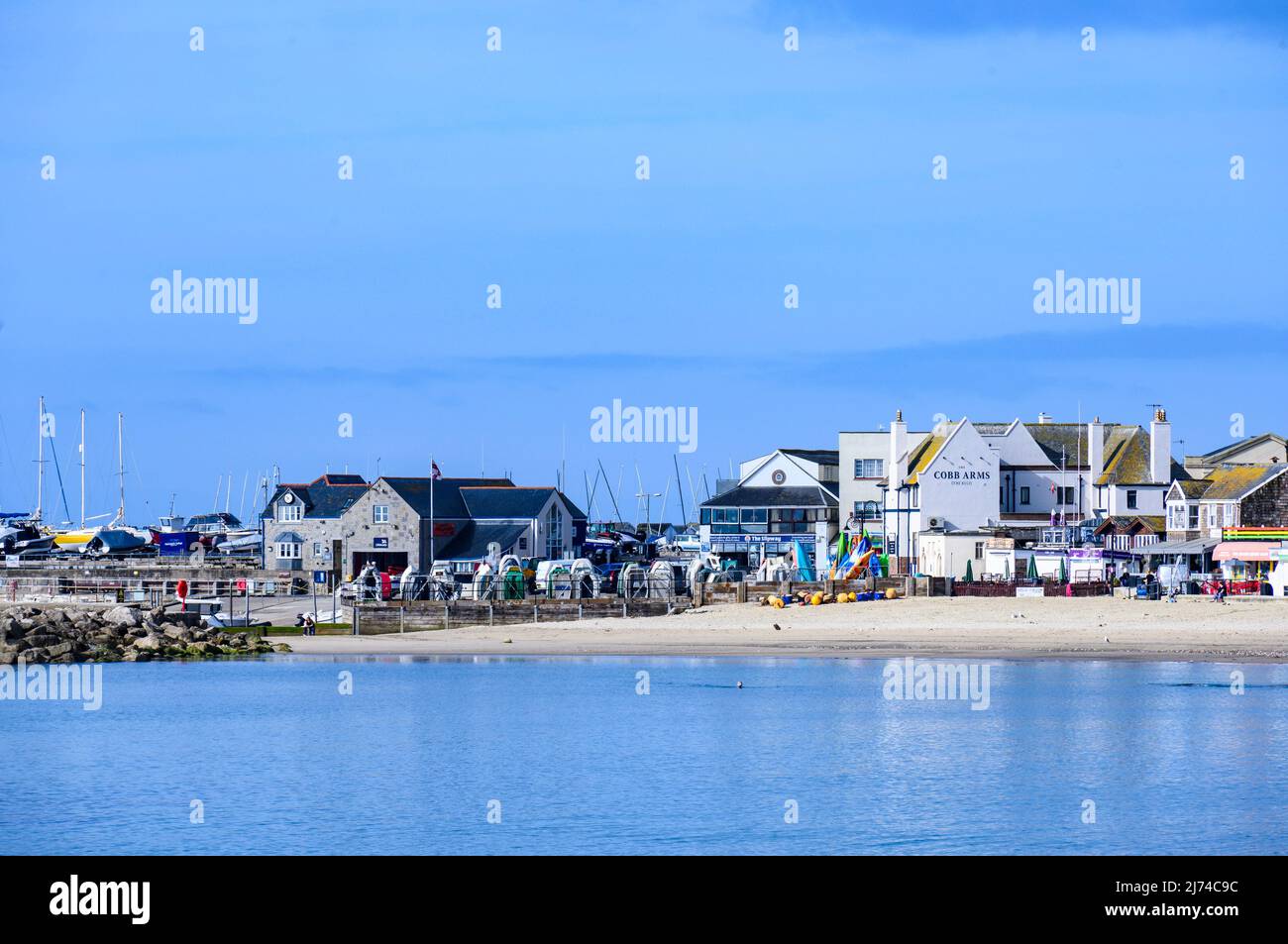 Lyme Regis, Dorset, UK. 6th May 2022. UK Weather: Scorching hot sunshine and clear blue skies at the seaside resort  of Lyme Regis. The sun was already blazing by 9am this morning at the pretty coastal resort. Credit: Celia McMahon/Alamy Live News Stock Photo