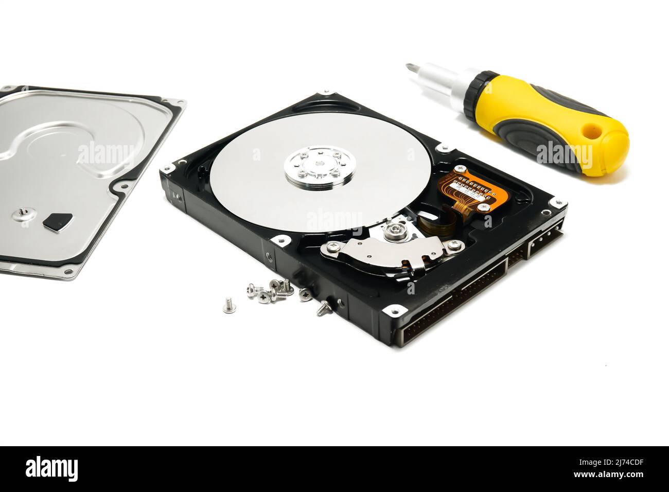 Open hard drive and screwdriver isolated on white background closeup