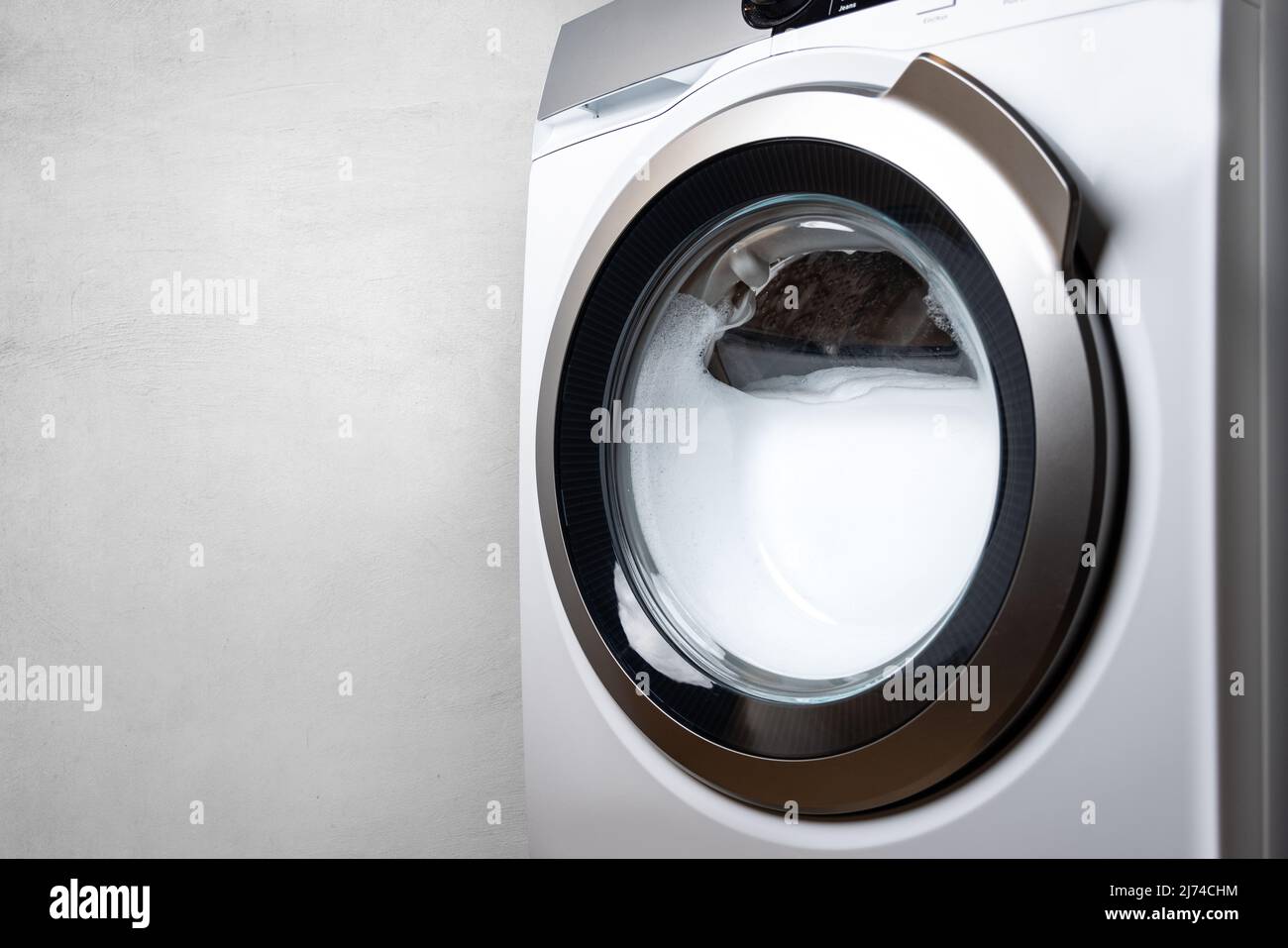 Washing machine full of foam Stock Photo Alamy