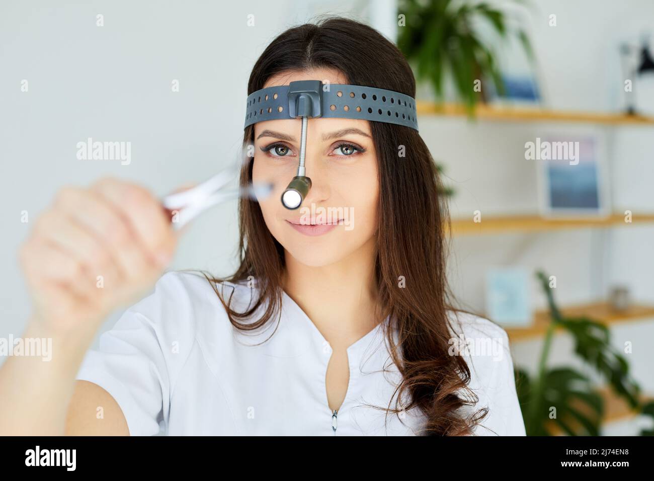 Instruments ENT doctor closeup with hand. Therapist. Female ENT doctor holding a tool. Nasal