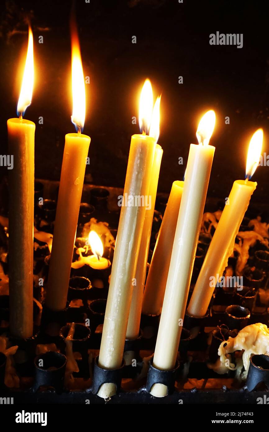 Set of votive candles burning Stock Photo Alamy