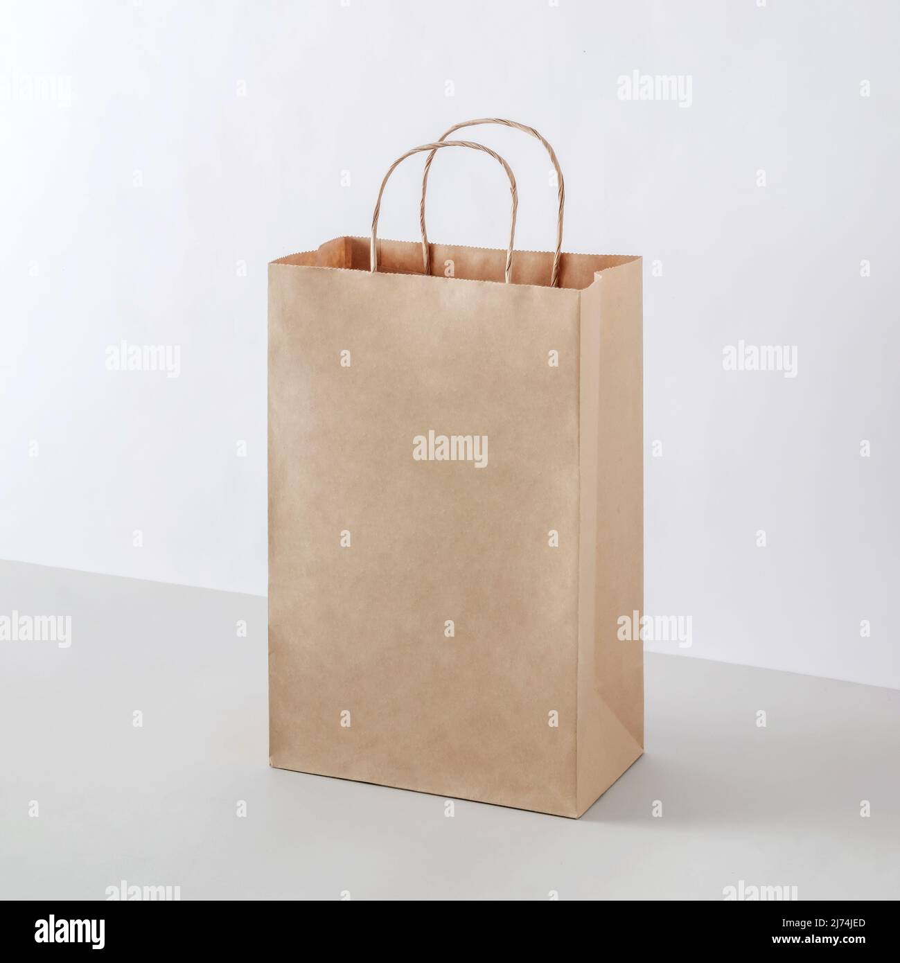 Cardboard package as a mockup for a business selling a purchase in a store. Paper for recycling and delivery. Stock Photo