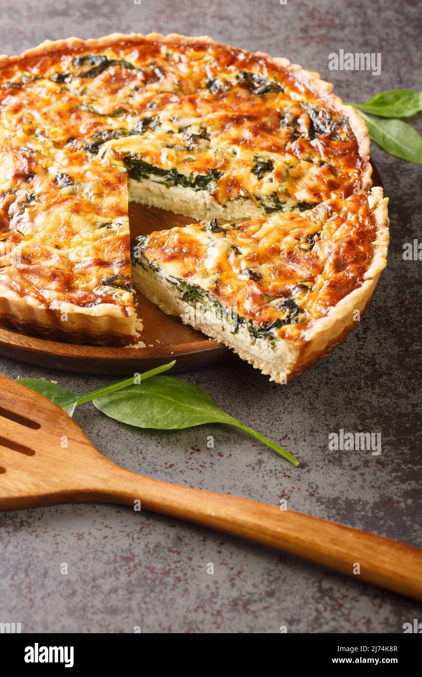 French Florentine quiche with spinach, cheese and egg custard closeup