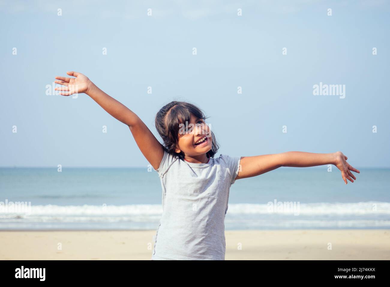cute girl 7 or 8 years old Asian American mixed enjoying holidays.travel medical insurance concept Stock Photo