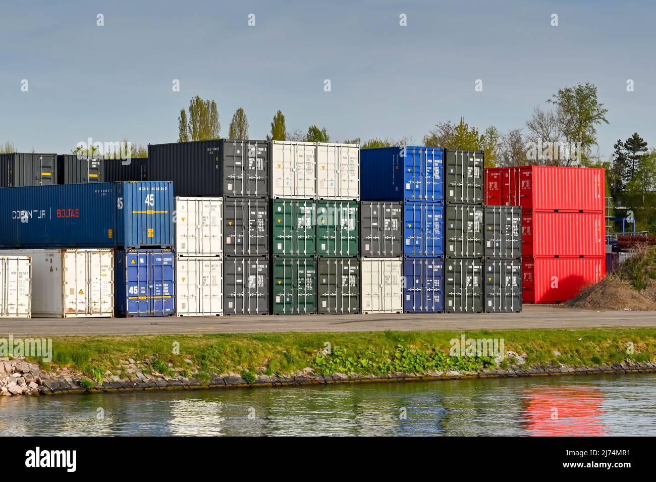 Basel, Switzerland April 2022 Stacks of shipping containers in a transport depot on the banks