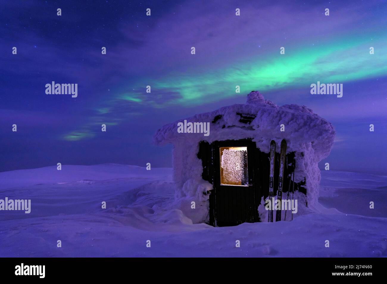 Snow-covered hut at night, Sweden, Dundret Naturreservat, GÃƒÂ¤llivare Stock Photo