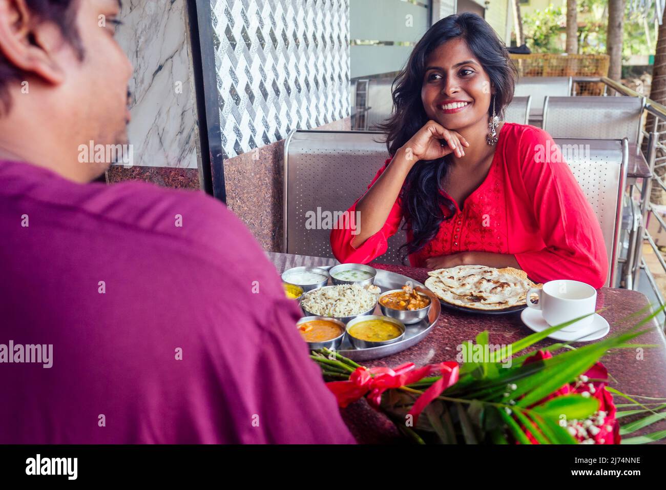 romance couple meeting at cafe and eating thali and drinking masala chai. valentines day dating concept Stock Photo