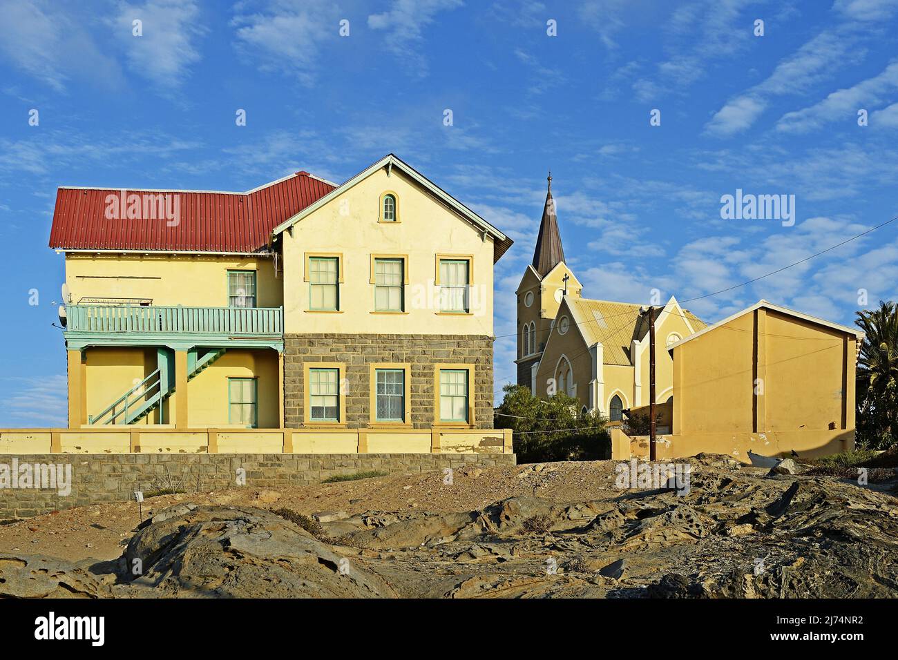 residential building and Felsenkirche church, Namibia, Luederitz Stock Photo