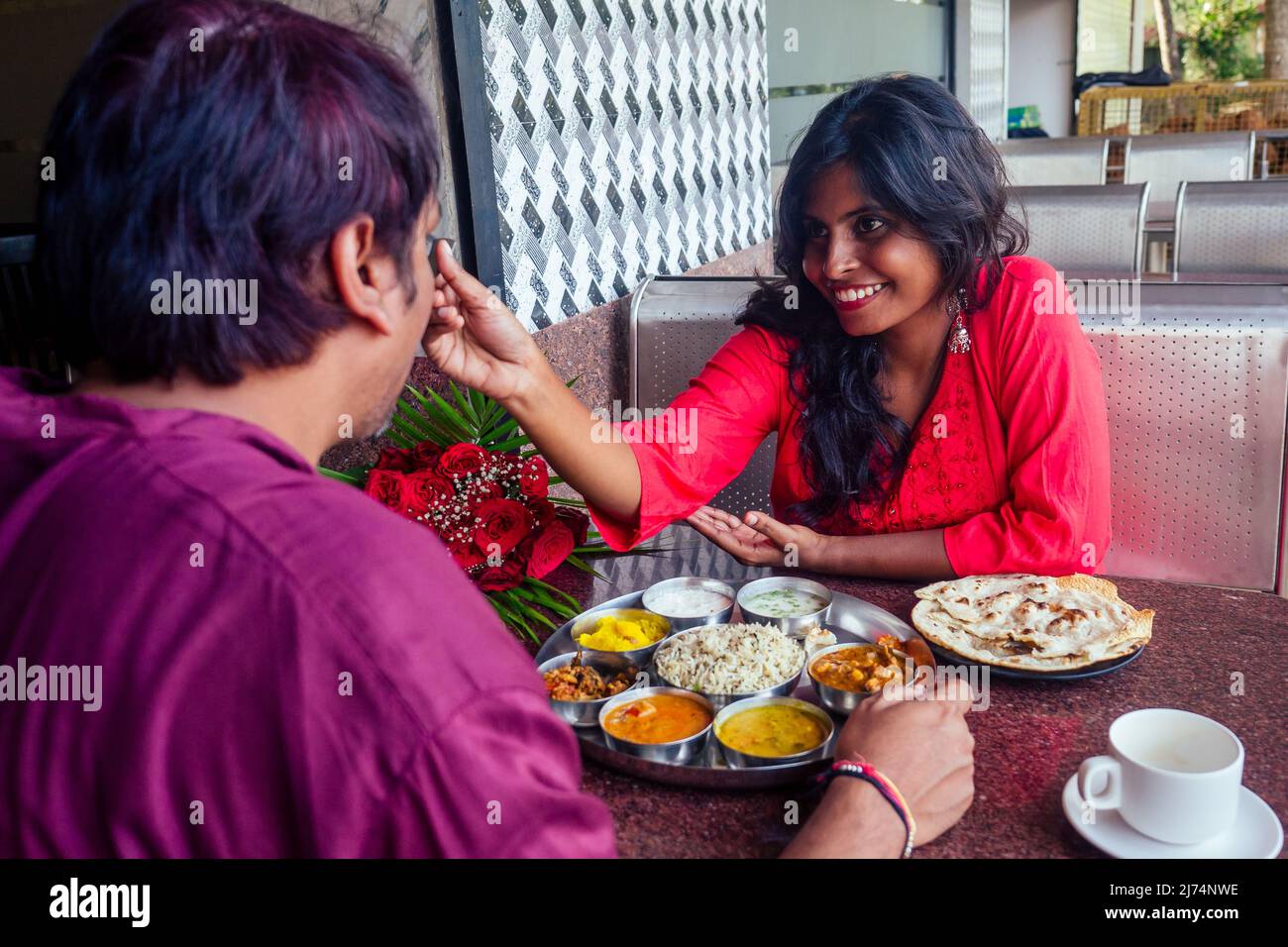 romance couple meeting at cafe and eating thali and drinking masala chai. valentines day dating concept Stock Photo