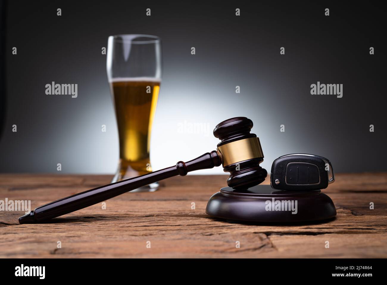 DUI Lawyer. Car Key And Gavel On Wooden Table Stock Photo