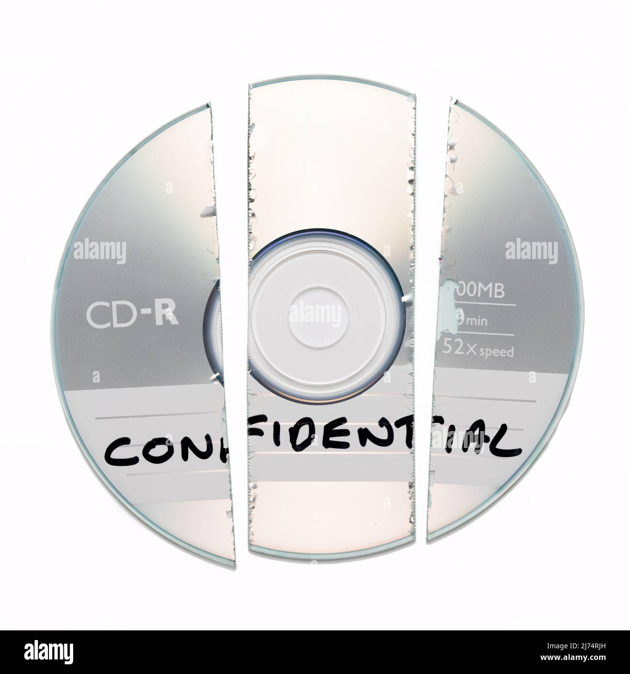 Shredded broken CD with Confidential written on it isolated on a white background Stock Photo