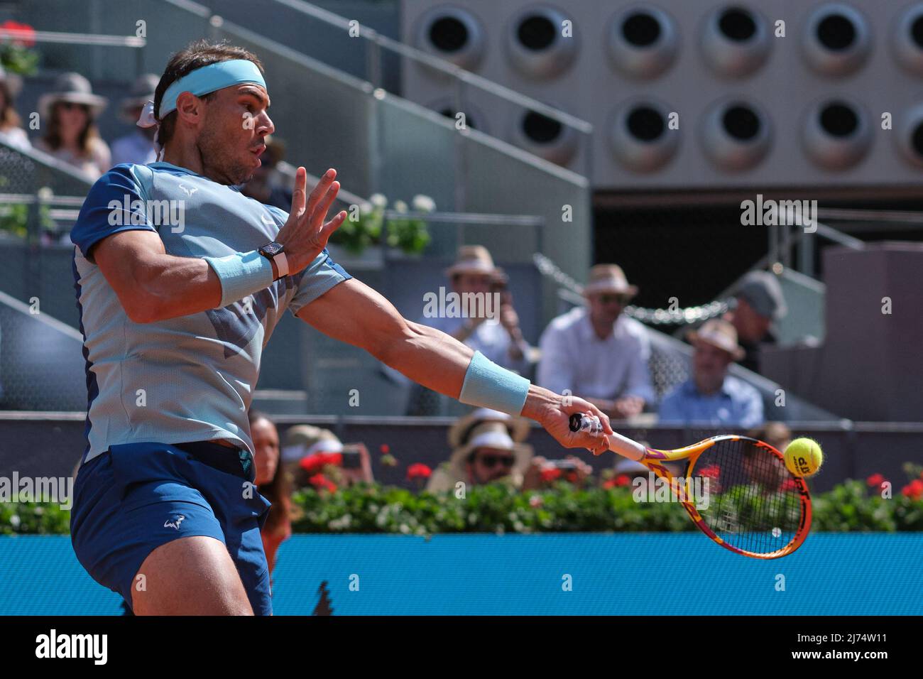 (220506) -- MADRID, May 6, 2022 (Xinhua) -- Rafael Nadal of Spain hits a return during the men's singles 3rd round match against David Goffin of Belgium at Madrid Open in Madrid, Spain, May 5, 2022. (Xinhua/Meng Dingbo) Stock Photo