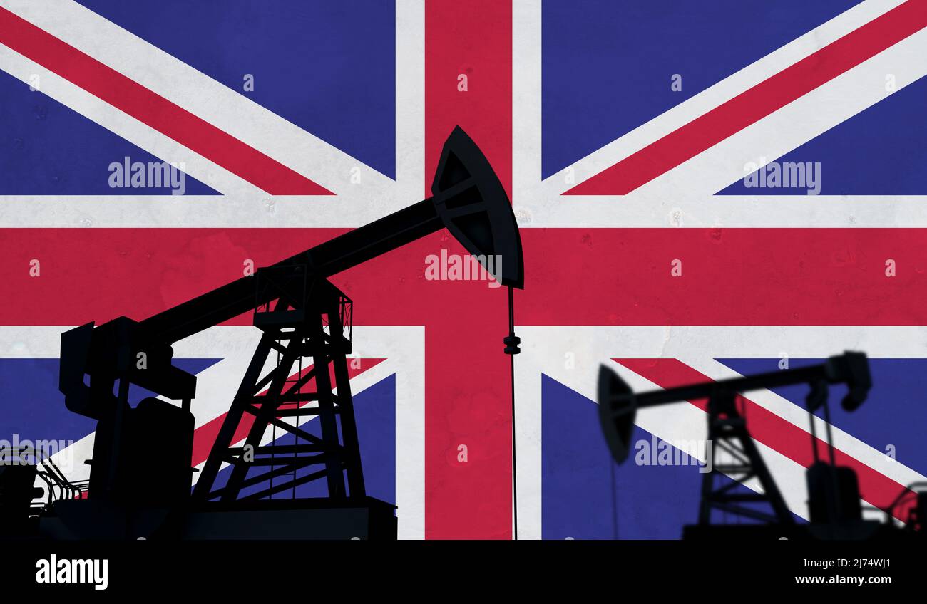 Oil and gas industry background. Oil pump silhouette against united kingdom flag. 3D Rendering Stock Photo