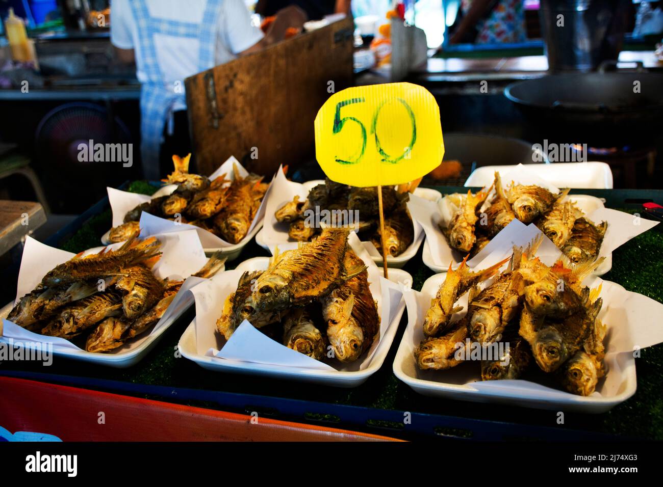 Crispy deep fried Java barb fish or silver barb fishes for sale thai people travelers travel visit at Local Talad Nam Lumphaya temple or Wat Lam Phaya Stock Photo