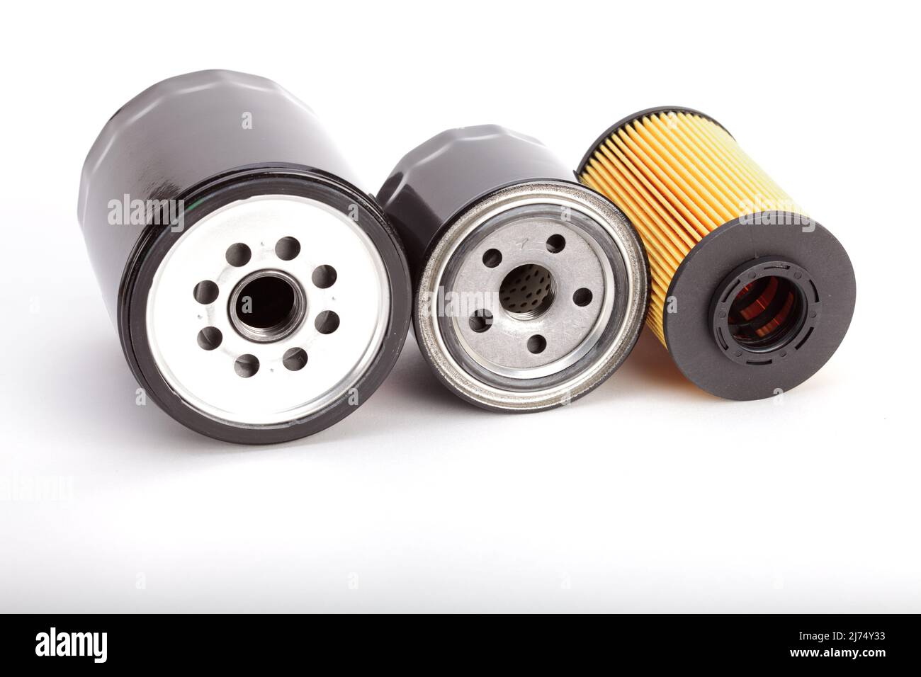 Three types of oil filters on a white background Stock Photo Alamy