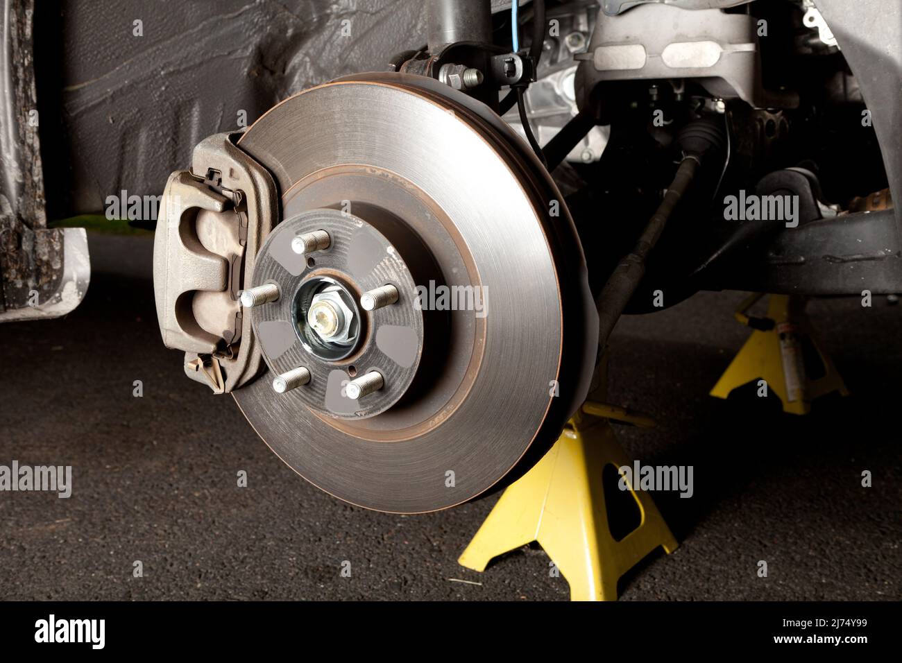 Brake disk and caliper assembly on a modern car about to be replaced