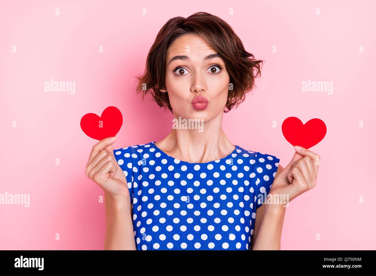 Photo of pretty young brunette lady hold hearts blow kiss wear blue ...