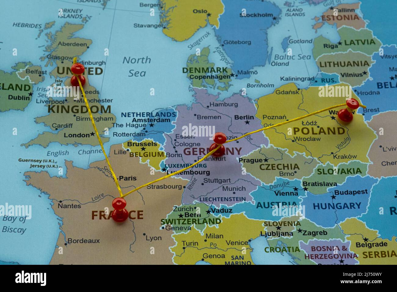 United Kingdom Poland Germany and France on map with red fastener, Europe travel route on map with red thumbtack, travel idea, vacation and road trip Stock Photo