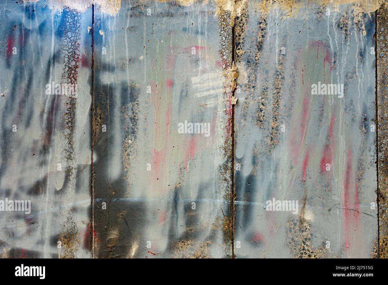 multicolored painted textured concrete surface. Propaganda and war. Stock Photo
