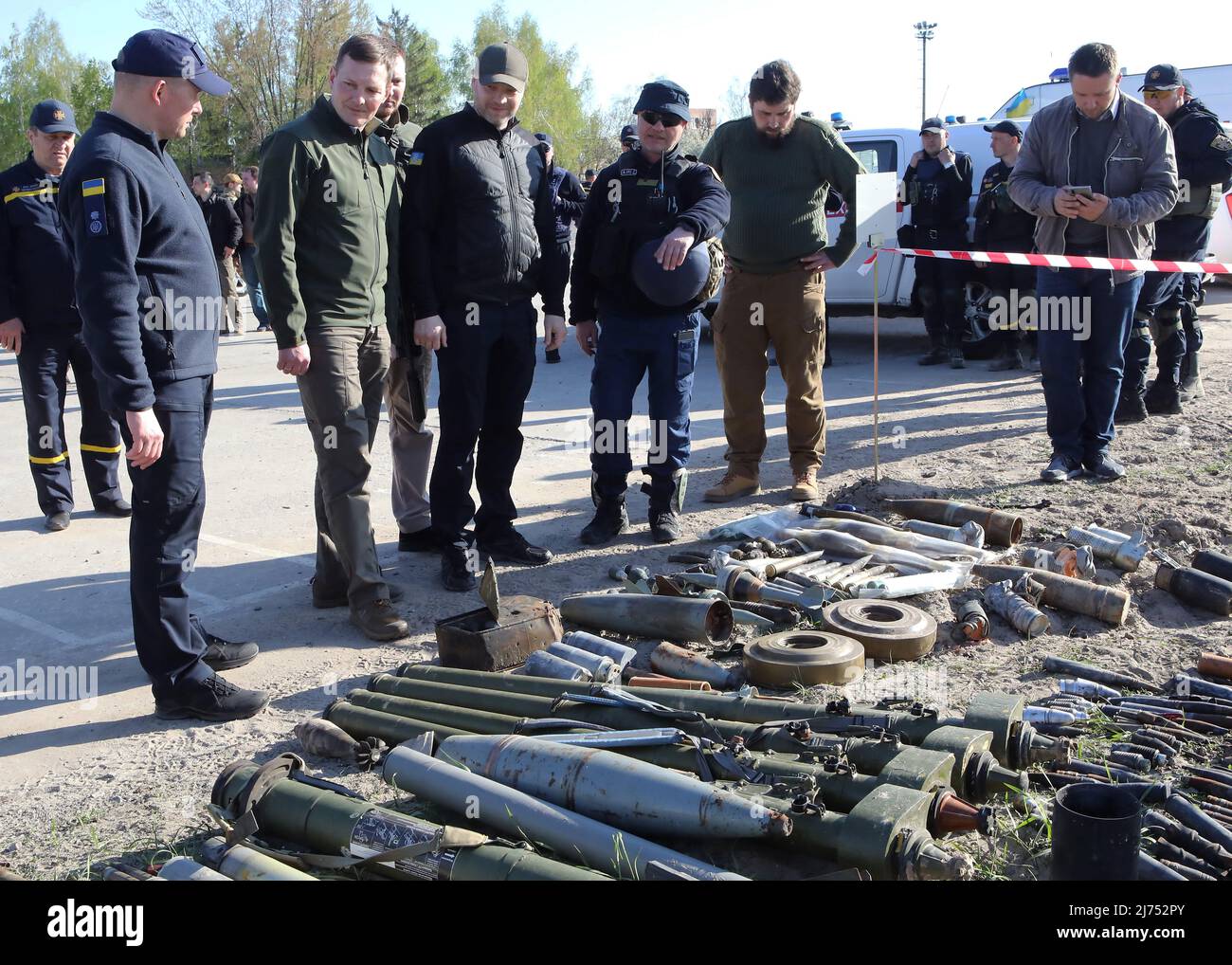 KYIV REGION, UKRAINE - MAY 5, 2022 - Minister of Internal Affairs of Ukraine Denys Monastyrskyy (C) looks at ammunition at Antonov Airport, an interna Stock Photo