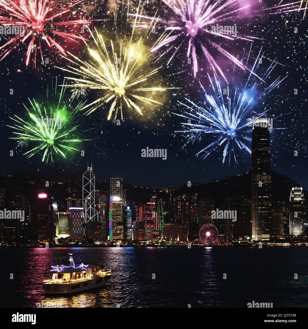 Night Hong Kong with colorful fireworks view from the Victoria Harbour ...