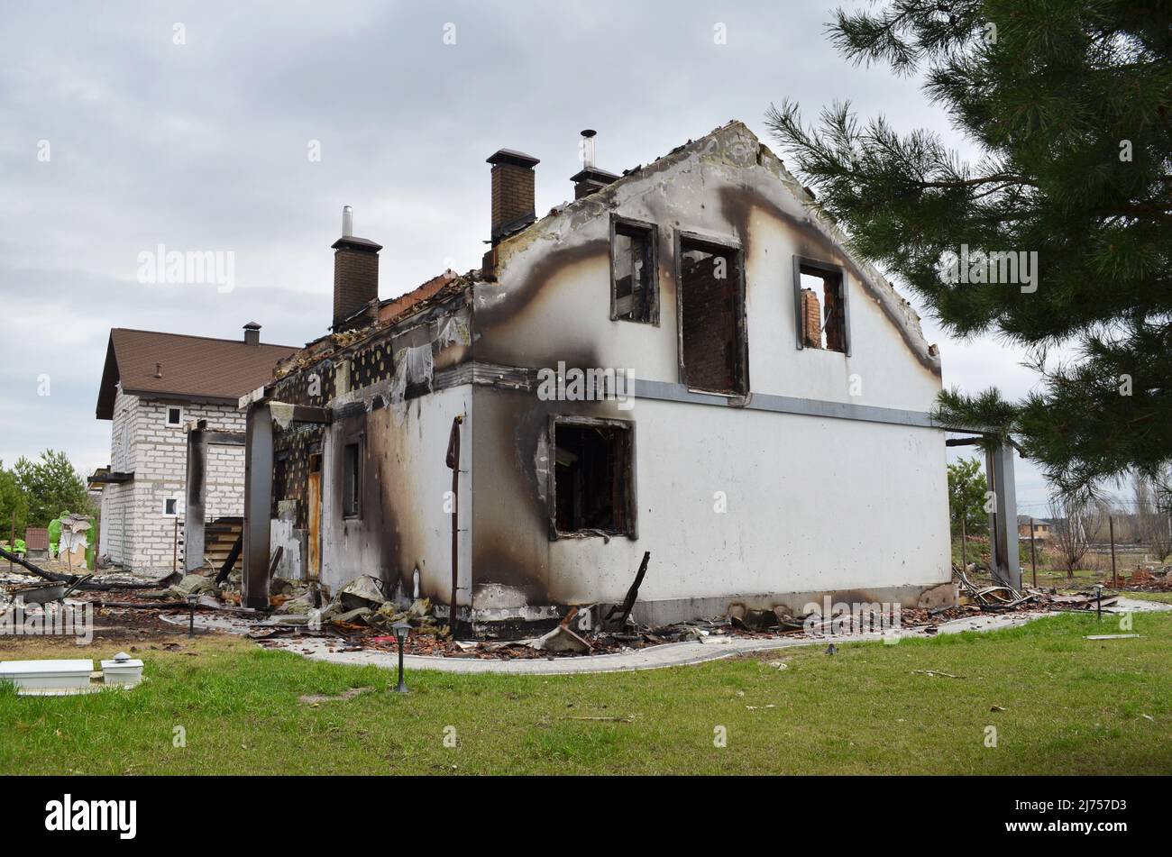 Dmytrivka village, Kyiv region, Ukraine - April 06, 2022: Private house burned out by the russian occupiers in the result of shelling. Stock Photo