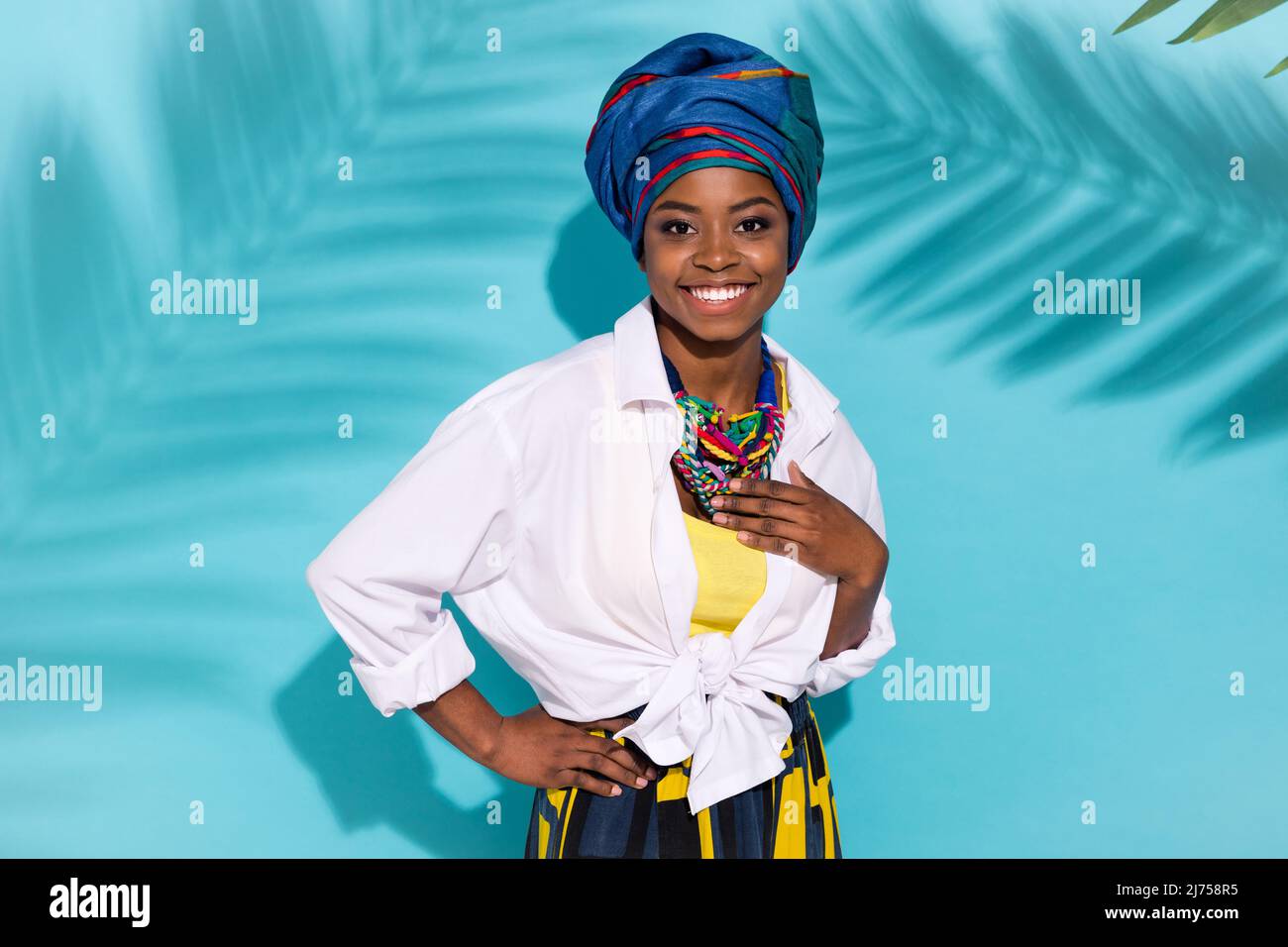 Photo of pretty lovely lady wear masai clothes necklace enjoy national day carnival isolated cyan color background Stock Photo Alamy