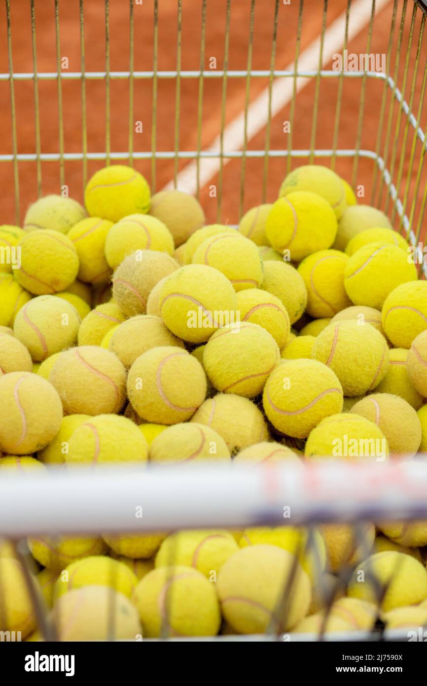 Picking up a tennis ball hires stock photography and images Alamy