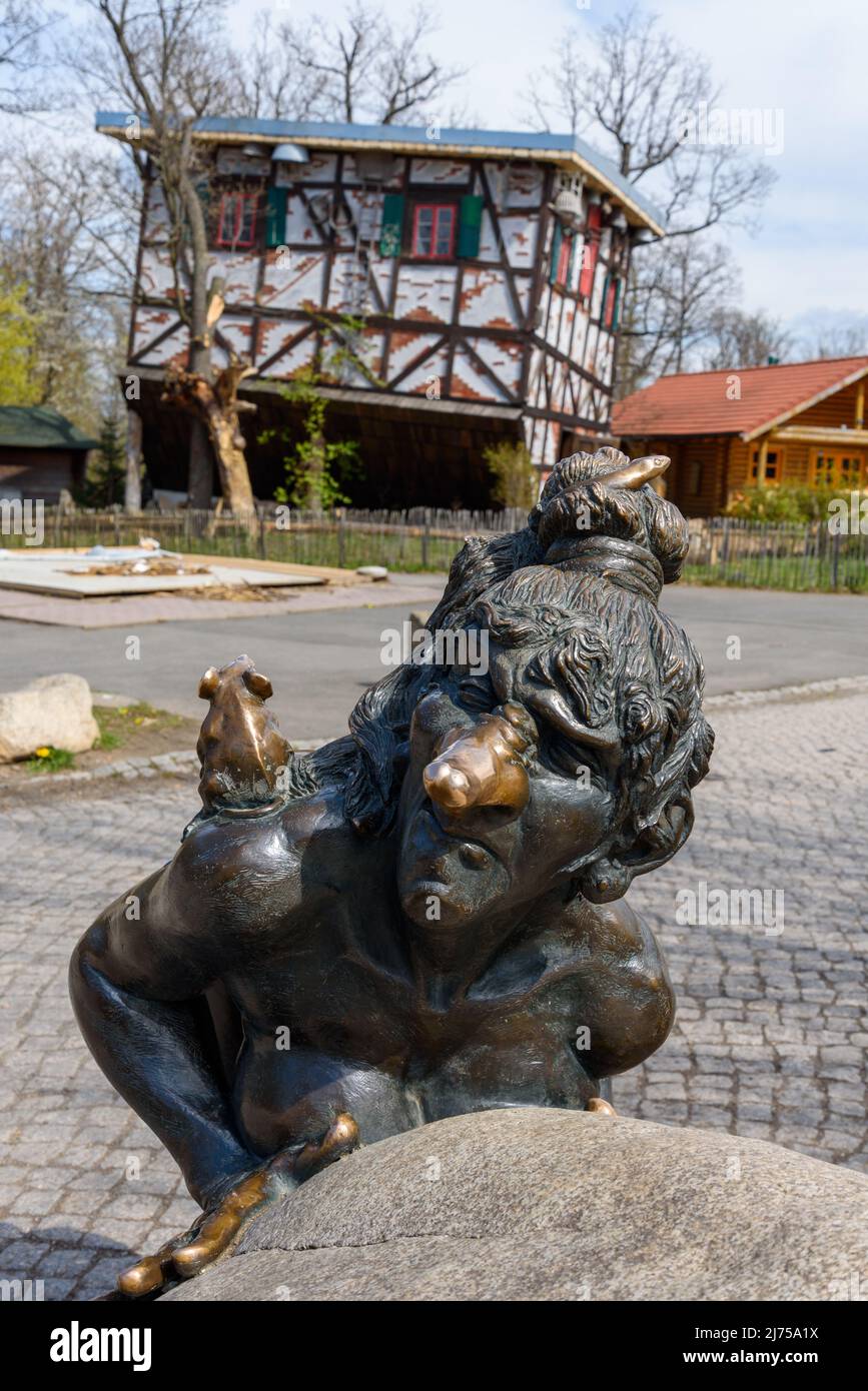 Statue of a witch on Hexentanzplatz in front of upended witches' house, Thale, Harz Mountains Stock Photo