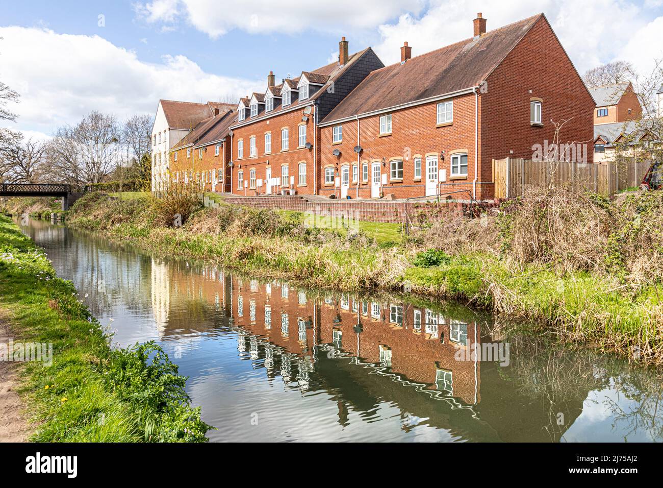 Modern waterside properties beside the restored Stroudwater Canal at Dudbridge, Stroud, Gloucestershire, England UK Stock Photo