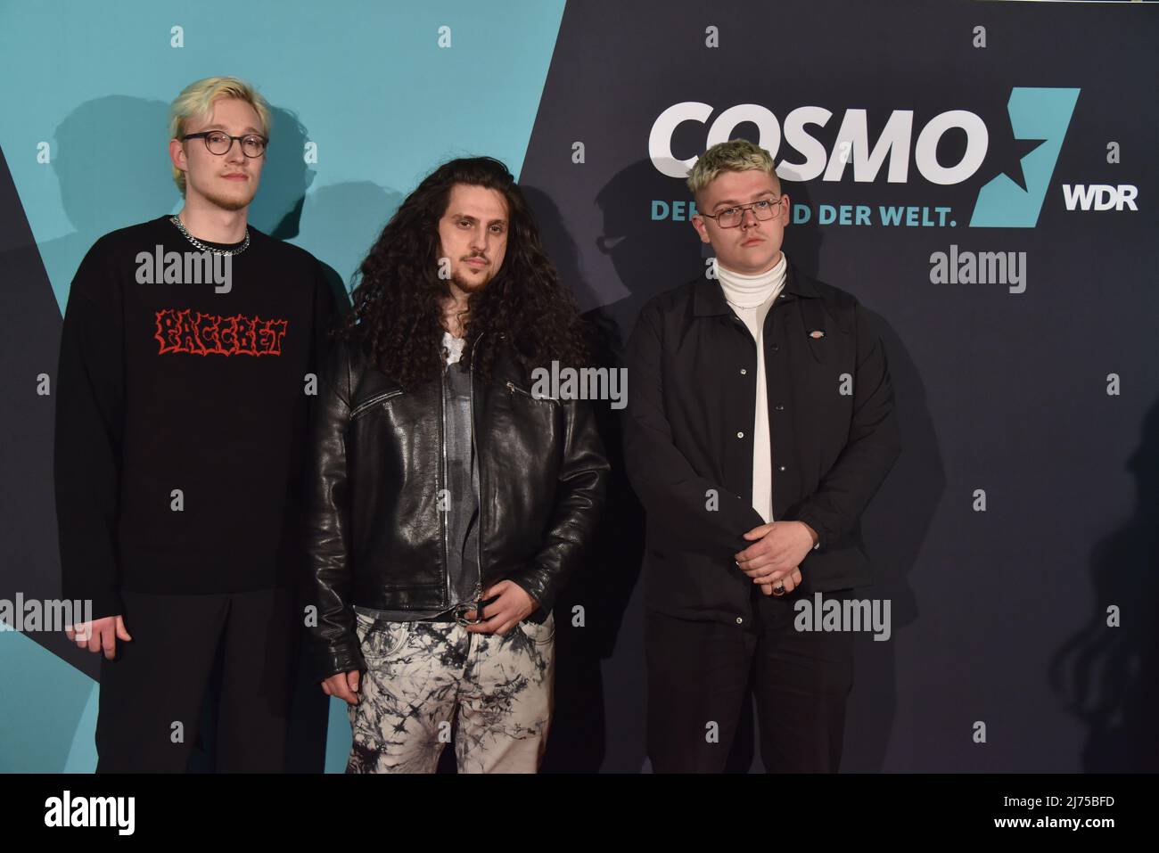03 May 2022, North Rhine-Westphalia, Cologne: The rappers Woke, Seeno and  Timor , l-r, comes to the premiere of the 5 part Cologne rap musical HYPE  to see on COSMO, the young