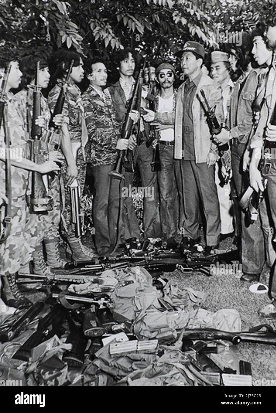 MNLF fighters surrender their firearms to President Ferdinand Marcos. Stock Photo
