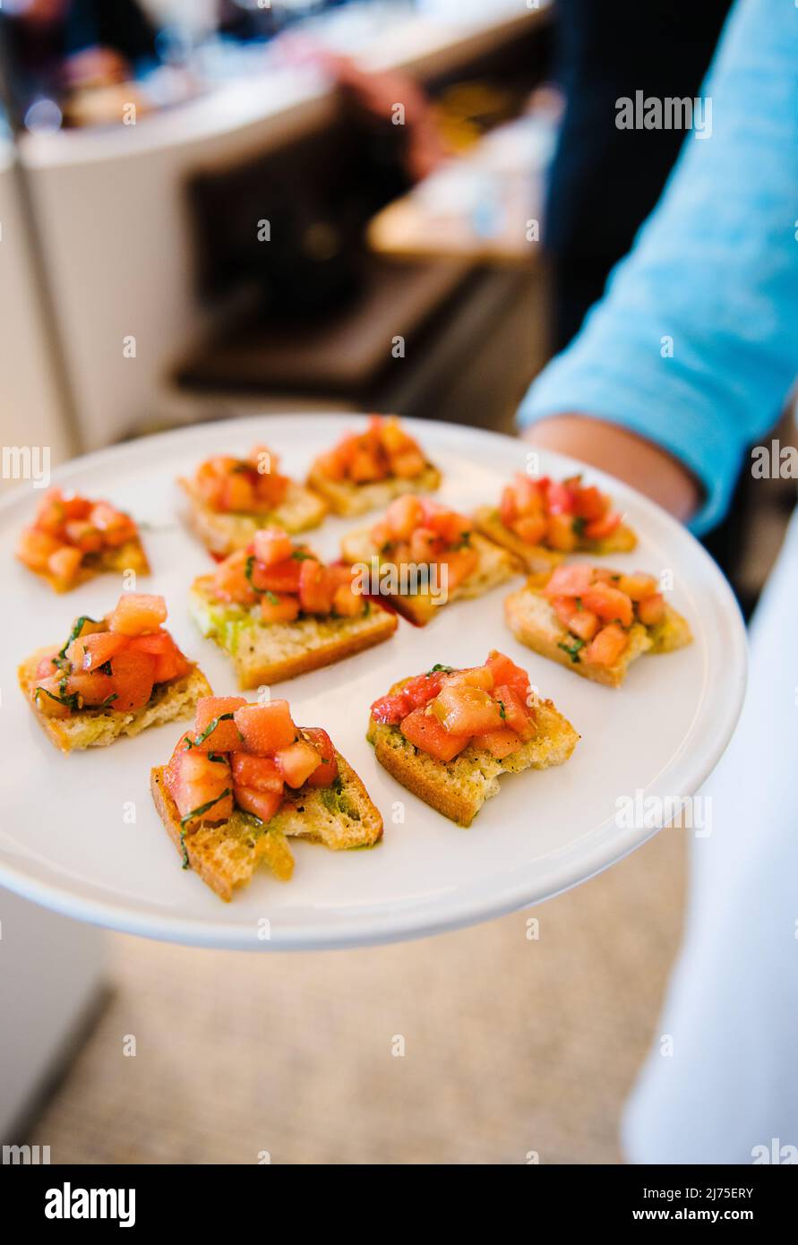 bruschetta hors devours being served at an event Stock Photo