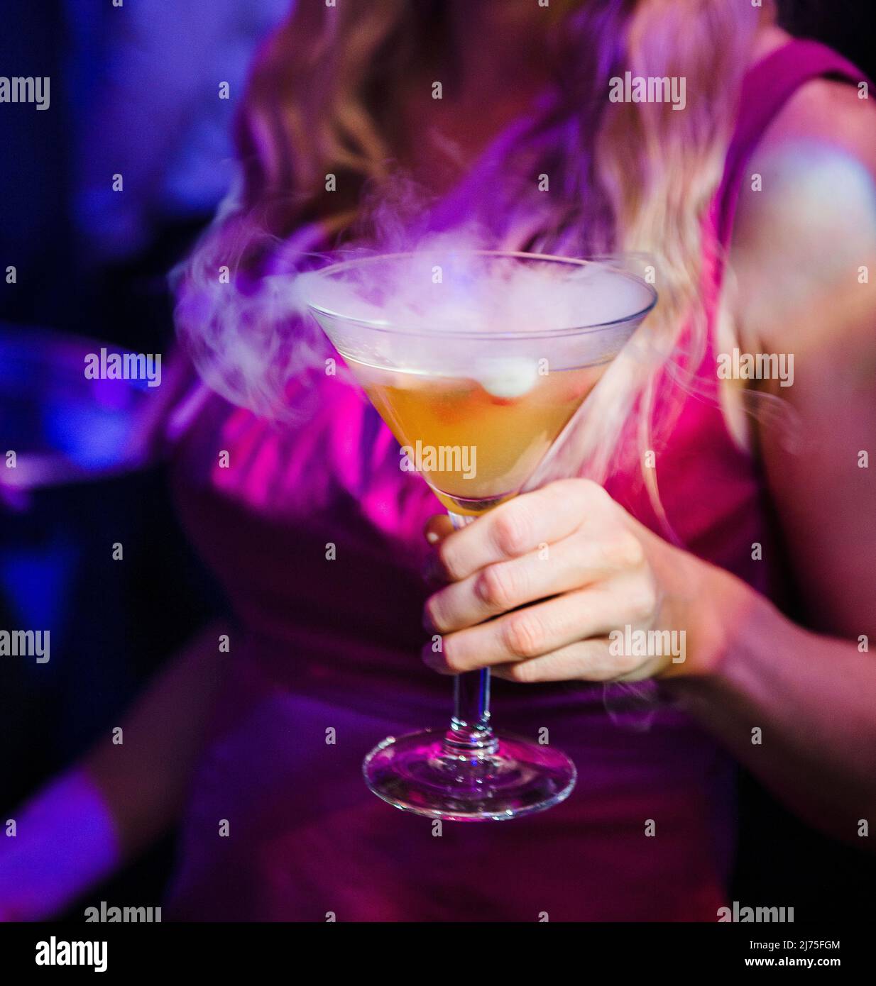 Woman holding alcohol drink hi-res stock photography and images - Alamy
