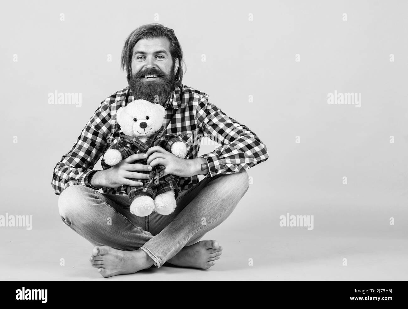 Gifts and holidays concept. This is for you. hipster like animal toy. Birthday holiday party celebration. feel happiness. Man with beard hold cute toy Stock Photo