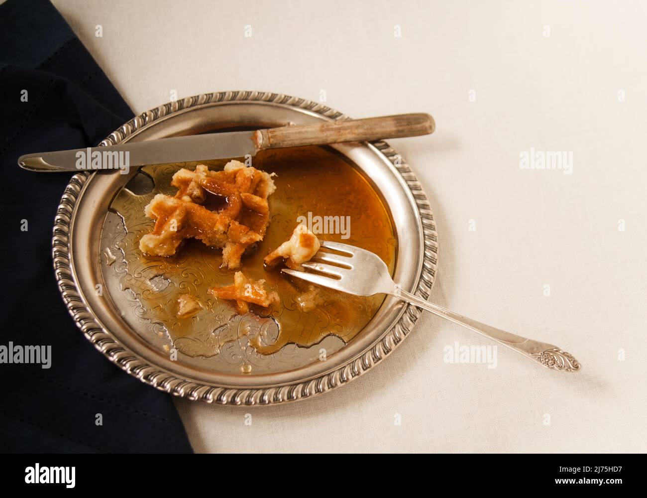 Half eaten waffles with syrup Stock Photo