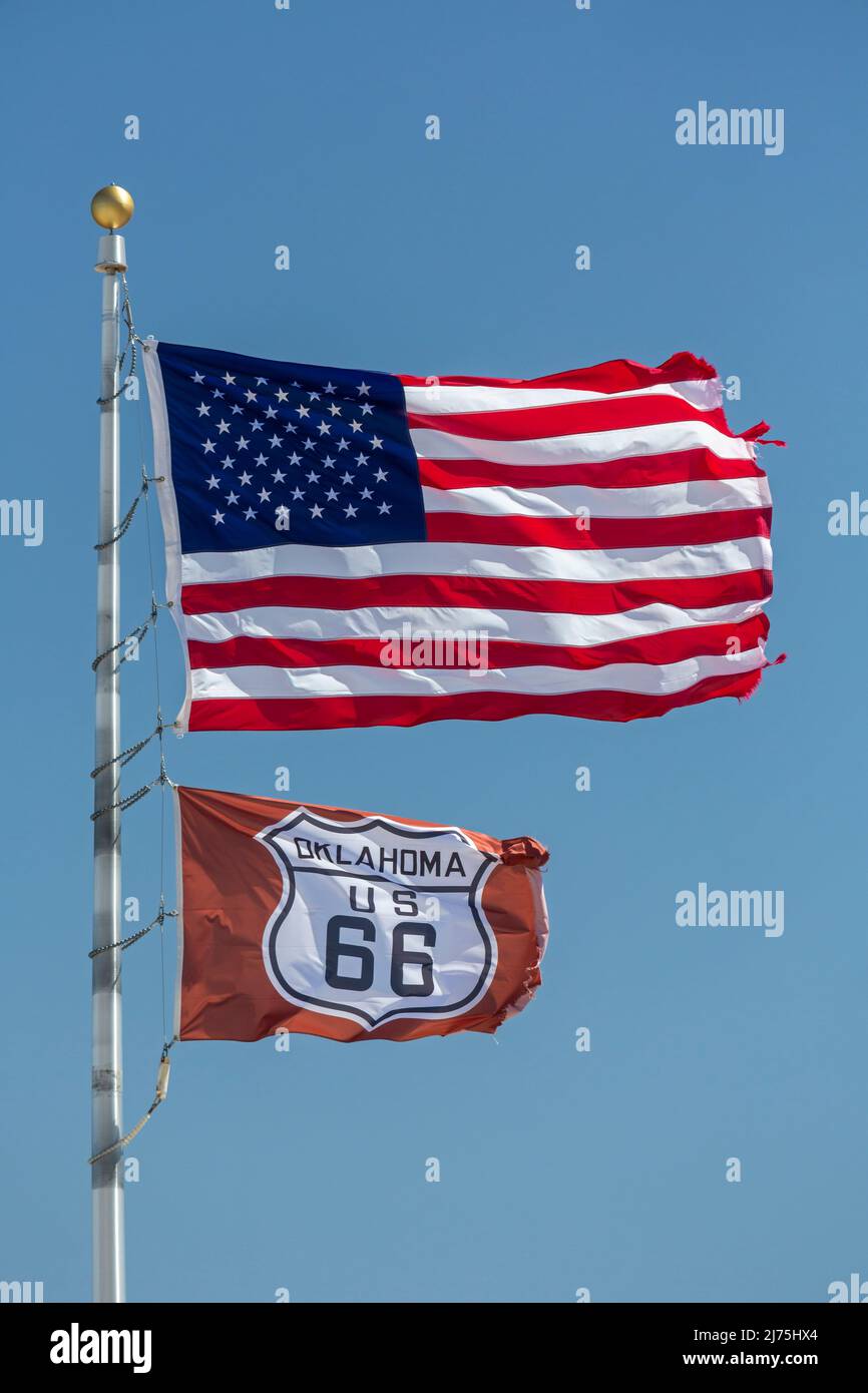 Elk City, Oklahoma - Flags on historic U.S. Route 66. Established in 1926, Route 66 ran from Chicago to Los Angeles. It was later replaced by Intersta Stock Photo