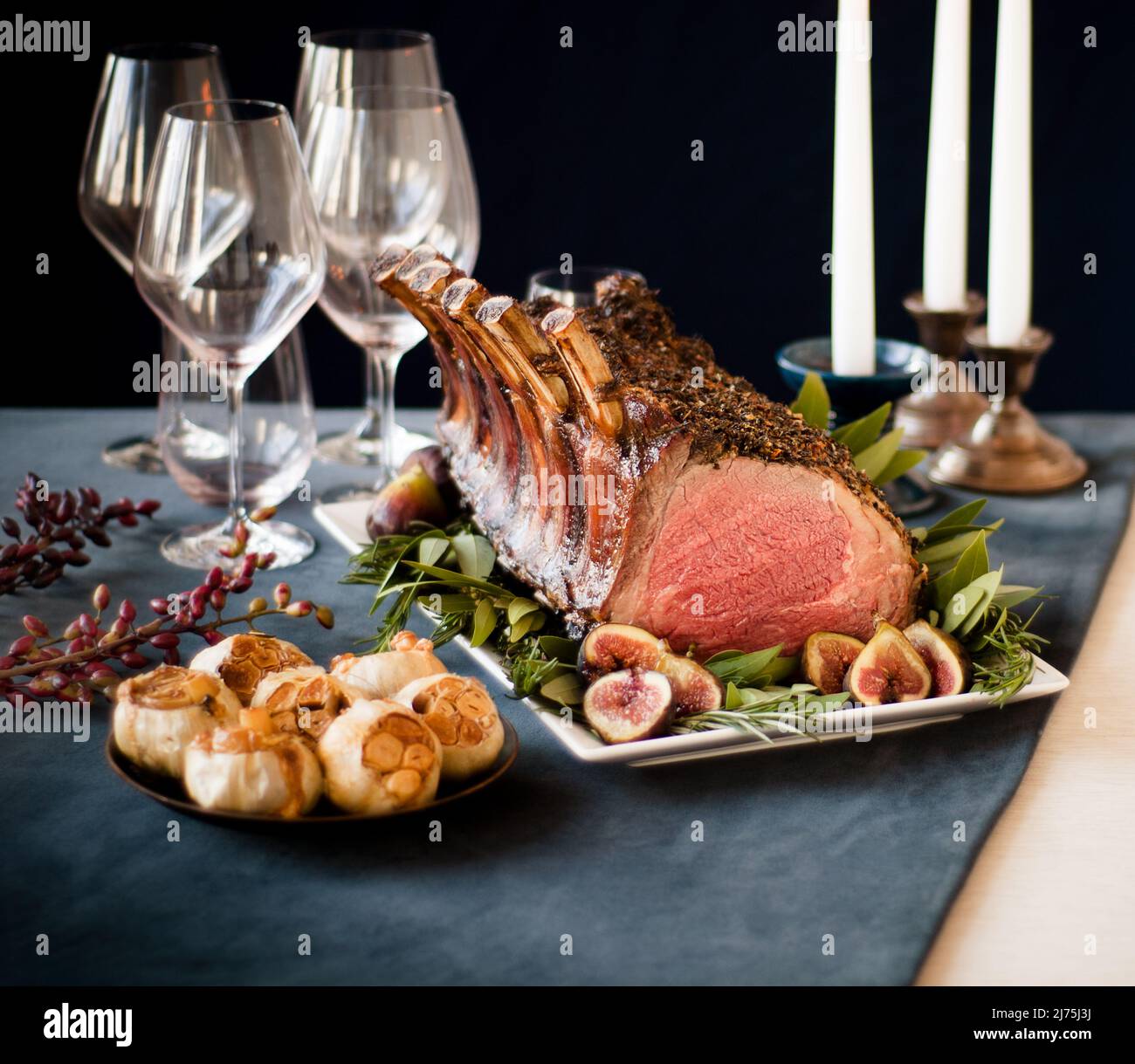 Aged Frenched prime rib roast with garlic and figs Stock Photo
