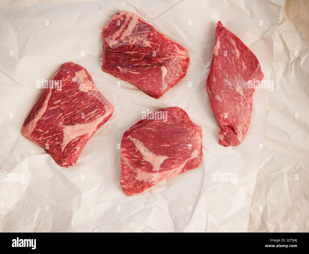 Raw Wagyu tri tip steaks on butcher paper Stock Photo Alamy